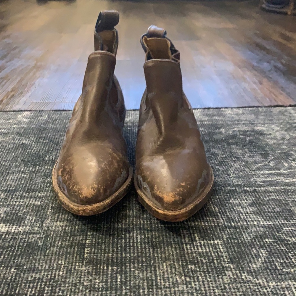 Distressed Free People leather cowboy booties with blue embroidery